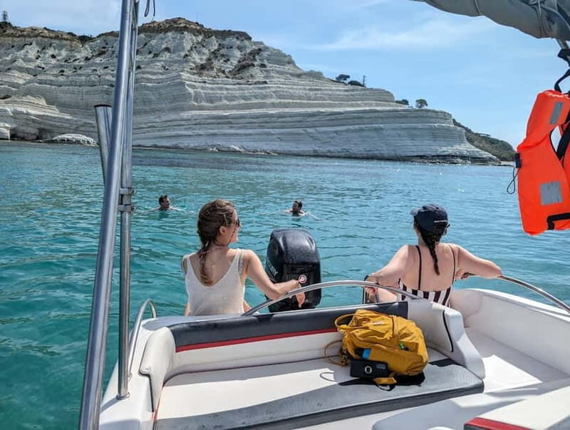 Swimming stop during the Scala dei Turchi Boat Tour in crystal-clear waters